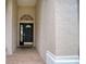 Front door entry with brick flooring and arched window detail at 12408 Seabrook Dr, Tampa, FL 33626