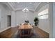 Bright dining room with wood table and chandelier at 12408 Seabrook Dr, Tampa, FL 33626