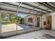 Screened-in garage with access to backyard at 12912 Willoughby Ln, Hudson, FL 34667