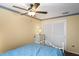 Bedroom with full bed, dresser and ceiling fan at 12912 Willoughby Ln, Hudson, FL 34667
