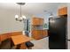 Bright kitchen with wood cabinets, tile backsplash, and breakfast nook at 12912 Willoughby Ln, Hudson, FL 34667