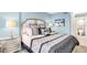 Bright bedroom featuring a comfortable king-size bed and ensuite bathroom access at 9415 Blind Pass Rd # 803, St Pete Beach, FL 33706