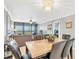 Elegant dining room with a marble table and six black leather chairs at 9415 Blind Pass Rd # 803, St Pete Beach, FL 33706