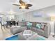 Open living area with comfortable seating and a view into the dining area at 9415 Blind Pass Rd # 803, St Pete Beach, FL 33706