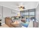 Spacious living room with comfortable sectional sofa and stunning water views at 9415 Blind Pass Rd # 803, St Pete Beach, FL 33706