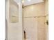 Clean bathroom with a large tiled shower and built-in bench at 9415 Blind Pass Rd # 803, St Pete Beach, FL 33706