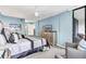 Large bedroom with king bed and dresser, plus access to balcony at 9415 Blind Pass Rd # 803, St Pete Beach, FL 33706