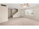 Bright living room with carpeted floors, ceiling fan, and a view of the backyard at 3247 38Th S Way # C, St Petersburg, FL 33711