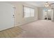 Living Room with tiled entryway, carpet and sliding glass doors at 3247 38Th S Way # C, St Petersburg, FL 33711