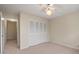 Bedroom with ceiling fan, large closet, and access to hallway at 3247 38Th S Way # C, St Petersburg, FL 33711