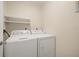 Laundry room with washer, dryer, and shelving at 3247 38Th S Way # C, St Petersburg, FL 33711