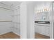 Clean bathroom with vanity, sink, and walk-in closet at 651 Jungle Queen Way, Longboat Key, FL 34228
