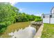 Private dock on a tranquil canal with lush mangrove trees at 651 Jungle Queen Way, Longboat Key, FL 34228