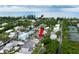 Aerial view showing home's location near the water and other houses at 651 Jungle Queen Way, Longboat Key, FL 34228