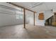Spacious garage with overhead storage and an extra window for natural light at 651 Jungle Queen Way, Longboat Key, FL 34228