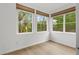 Bright bedroom with multiple windows and light wood flooring at 651 Jungle Queen Way, Longboat Key, FL 34228