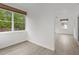 Bright bonus room with large windows and wood-look flooring at 651 Jungle Queen Way, Longboat Key, FL 34228