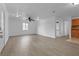 Open living room with light gray vinyl flooring and ceiling fan at 651 Jungle Queen Way, Longboat Key, FL 34228
