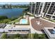 Aerial view of community with bay view, pool, landscaping, and secure garage at 6 Belleview Blvd # 706, Belleair, FL 33756