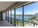 Enjoy the picturesque water view from this condo balcony with black metal railings and neutral flooring at 6 Belleview Blvd # 706, Belleair, FL 33756