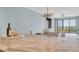 Bright dining area featuring a wine rack with a glass table and balcony access with views of the city at 6 Belleview Blvd # 706, Belleair, FL 33756