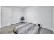 Simple bedroom with a zebra-print bedspread and a door at 9156 85Th Ave, Seminole, FL 33777