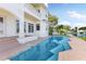 Large pool with brick patio and house view at 900 Harbor Is, Clearwater, FL 33767