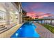 Relaxing pool area with water views and sunset at 900 Harbor Is, Clearwater, FL 33767