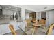 View of dining area with kitchen and breakfast bar at 7518 Clanton Trl, Hudson, FL 34667