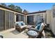 Cozy patio with wicker furniture, creating a relaxing space at 7518 Clanton Trl, Hudson, FL 34667