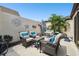 Private patio with seating area and tropical plants at 7518 Clanton Trl, Hudson, FL 34667