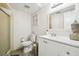 Clean bathroom with white vanity, toilet and shower at 7518 Clanton Trl, Hudson, FL 34667