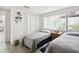 Guest bedroom with twin beds and window access at 7518 Clanton Trl, Hudson, FL 34667