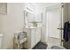 Bright bathroom with white vanity, shower, and updated fixtures at 7518 Clanton Trl, Hudson, FL 34667