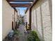 Pathway with pergola leading to a private courtyard at 7518 Clanton Trl, Hudson, FL 34667