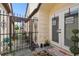 Front entrance with decorative gate and double doors at 7518 Clanton Trl, Hudson, FL 34667