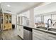 Kitchen features white cabinets, granite countertops, and stainless steel appliances at 7518 Clanton Trl, Hudson, FL 34667