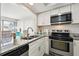 Clean kitchen with stainless steel appliances and granite countertops at 7518 Clanton Trl, Hudson, FL 34667