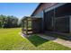 Small screened porch with wooden frame at 13600 Ponce De Leon Blvd, Brooksville, FL 34601