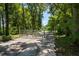 Long driveway entrance with metal gate leading to a private property at 13600 Ponce De Leon Blvd, Brooksville, FL 34601