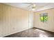 Bright bedroom with ceiling fan and window at 13600 Ponce De Leon Blvd, Brooksville, FL 34601