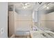 Clean bathroom featuring a bathtub and a large mirror at 13600 Ponce De Leon Blvd, Brooksville, FL 34601