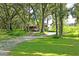 Mobile home on a spacious lot with mature trees and a detached shed at 13600 Ponce De Leon Blvd, Brooksville, FL 34601