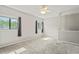 Bright and airy bedroom with two windows and ceiling fan at 13600 Ponce De Leon Blvd, Brooksville, FL 34601