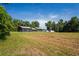 Property features a large backyard with a home and detached shed at 13600 Ponce De Leon Blvd, Brooksville, FL 34601