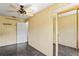 Bedroom with ceiling fan and mirrored closet at 13600 Ponce De Leon Blvd, Brooksville, FL 34601