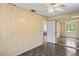 Bedroom with mirrored closet doors and ceiling fan at 13600 Ponce De Leon Blvd, Brooksville, FL 34601