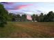 Dark-colored home with a large yard at sunset at 13600 Ponce De Leon Blvd, Brooksville, FL 34601