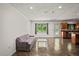 Living room with a couch, coffee table, and view of the backyard at 13600 Ponce De Leon Blvd, Brooksville, FL 34601