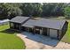 House with attached garage and large green lawn at 13600 Ponce De Leon Blvd, Brooksville, FL 34601